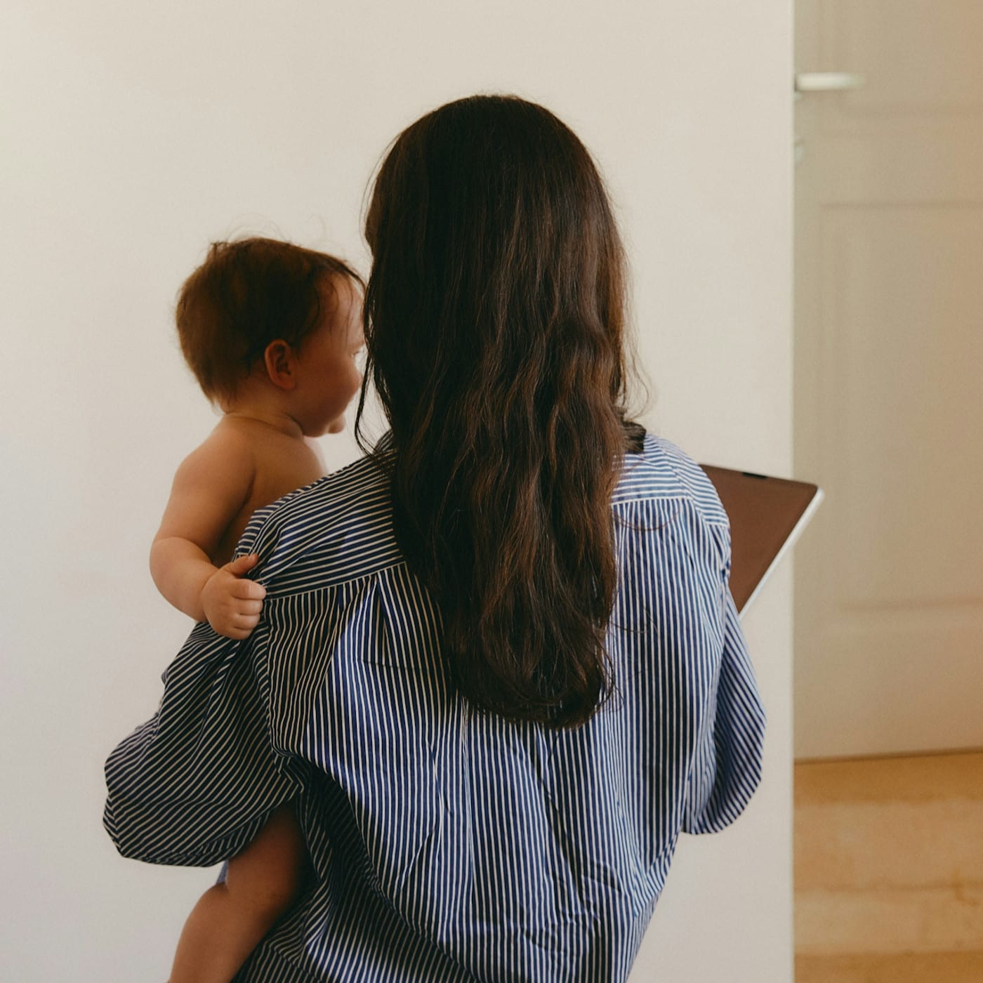 A mom gets her child ready for travel. She learned about tips to travel with children from therapy in LA.