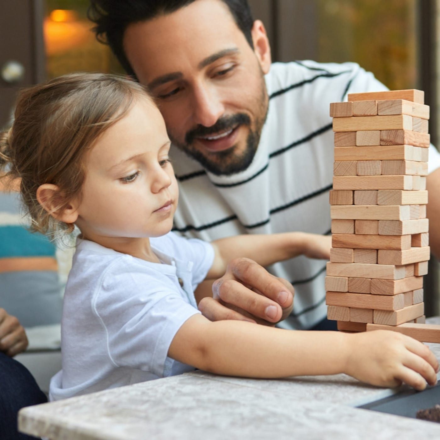 A parent and child playing after a play therapy session in LA at Child Therapy Center La.