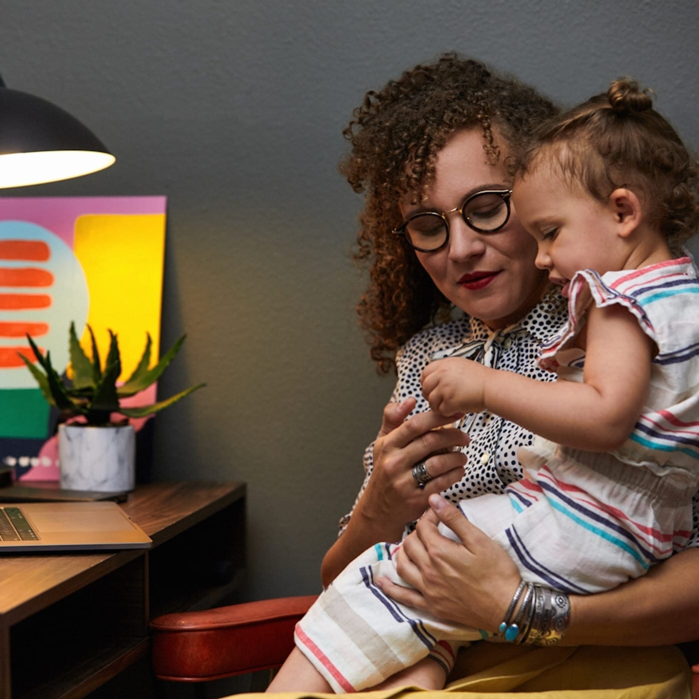 A mom and daughter co- regulating in a therapy office in Los Angeles.